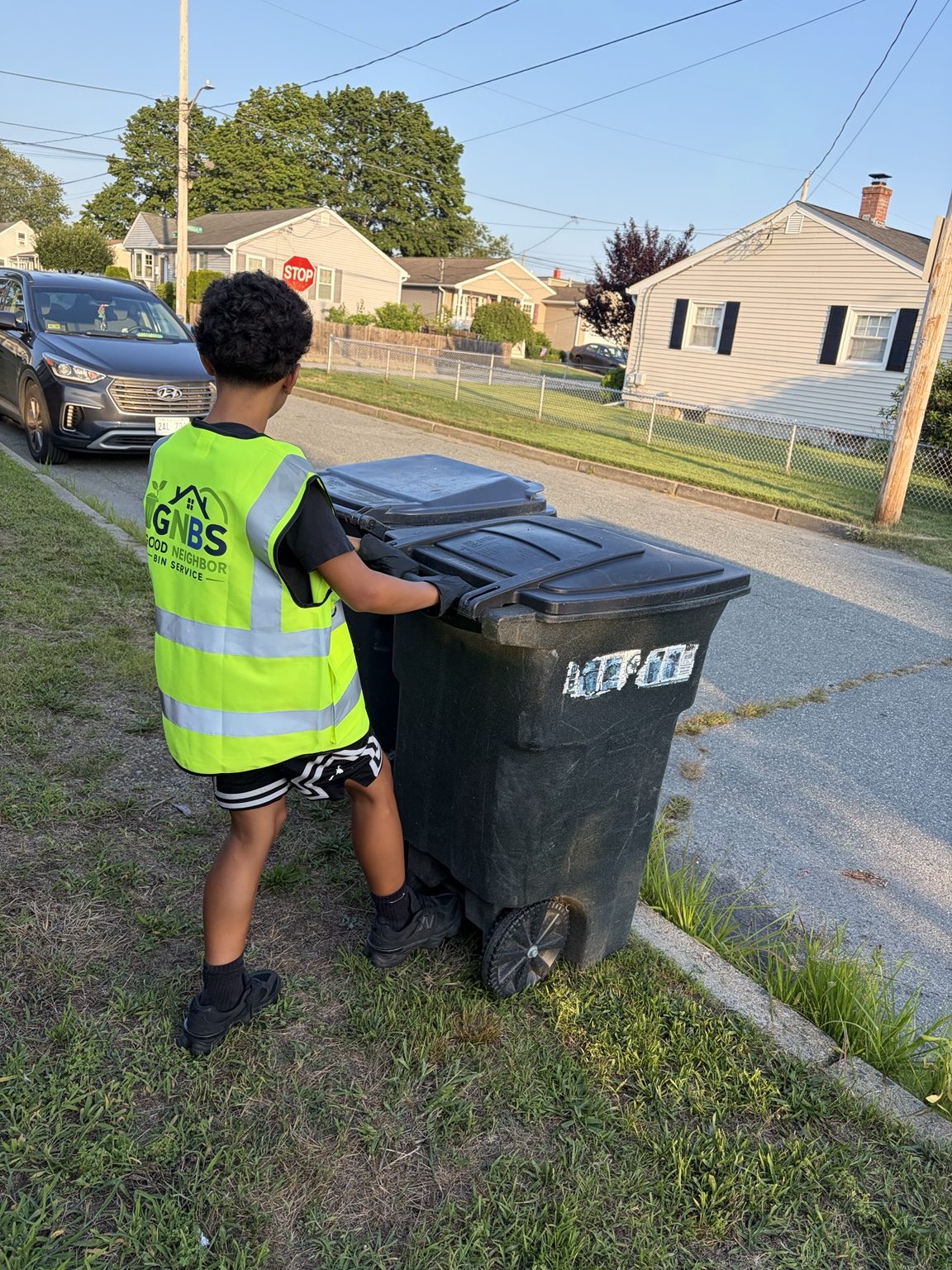 Good Neighbor Bin Service helping with trash bins in a local neighborhood